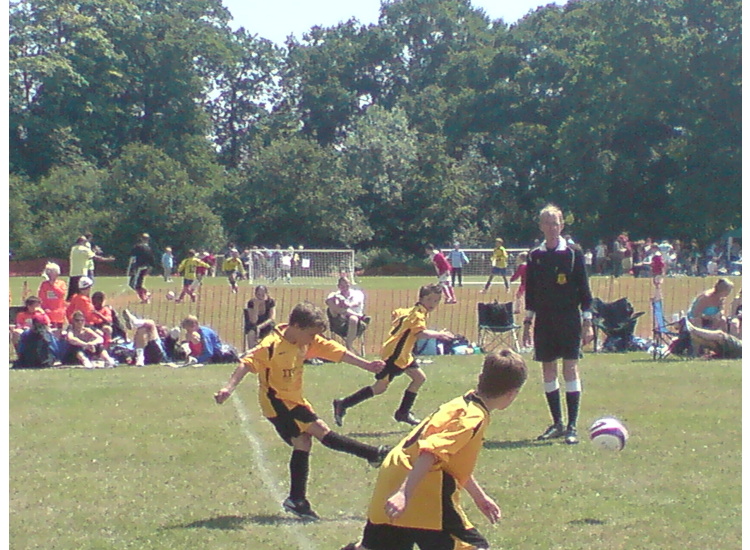 Jack W strikes the ball for Harvey and Tom to chase
