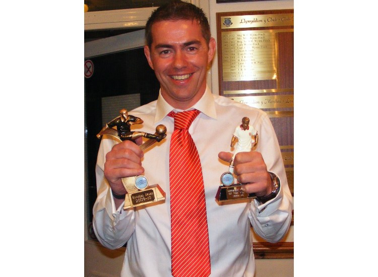 GWION ALL SMILES WITH HIS AWARDS
