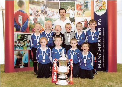 UNDER 9S PUMAS WITH THE F.A.CUP AT THE SALFORD MINI SOCCER TOURNAMENT