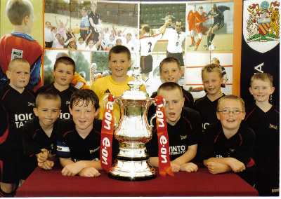 SOME OF THIS SEASONS SQUAD WITH THE F.A.CUP AT THE SALFORD MINI SOCCER FESTIVAL