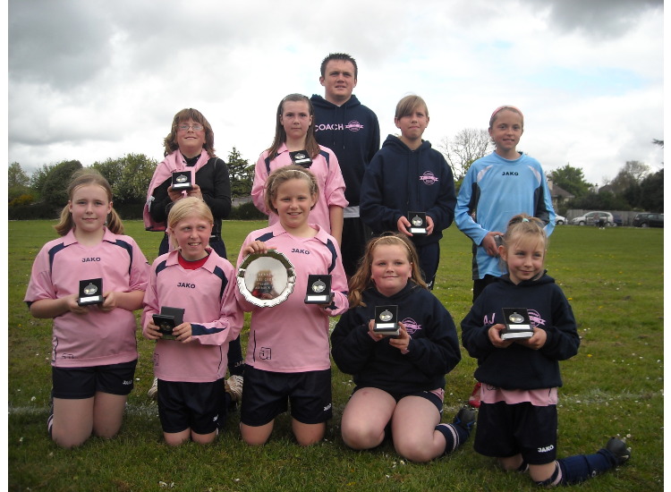 the u11 team with their runners up trophy and medals
