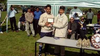 Shofiqul Islam recieving the manager of the year award success in winning league championship and runners up in the cup