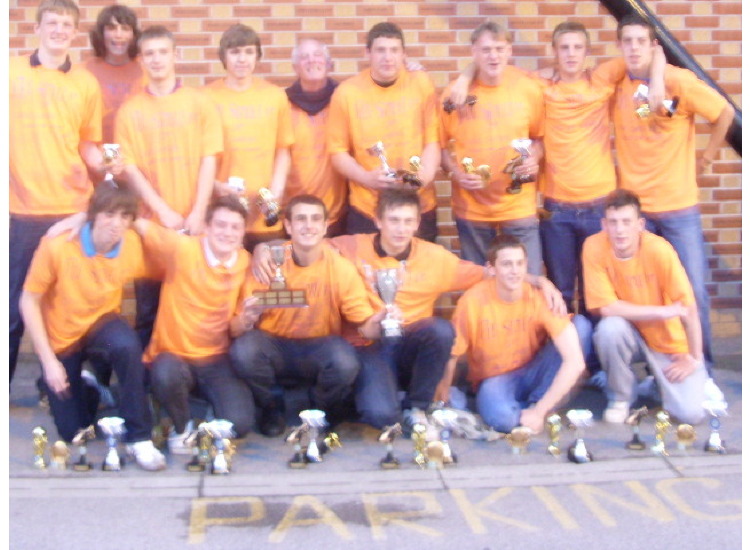 THE LADS WITH THE VARIOUS CUPS AND AWARDS