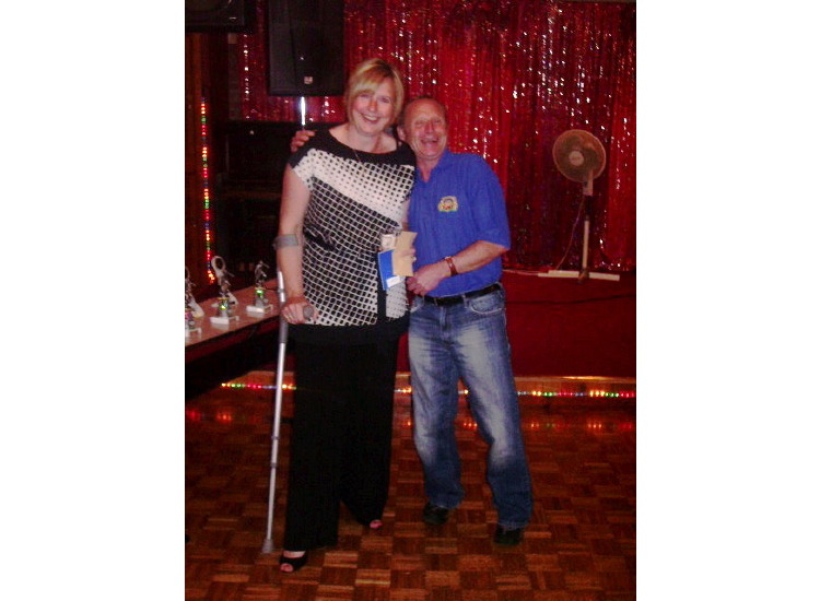 Val Collier collecting vouchers for washing the kits