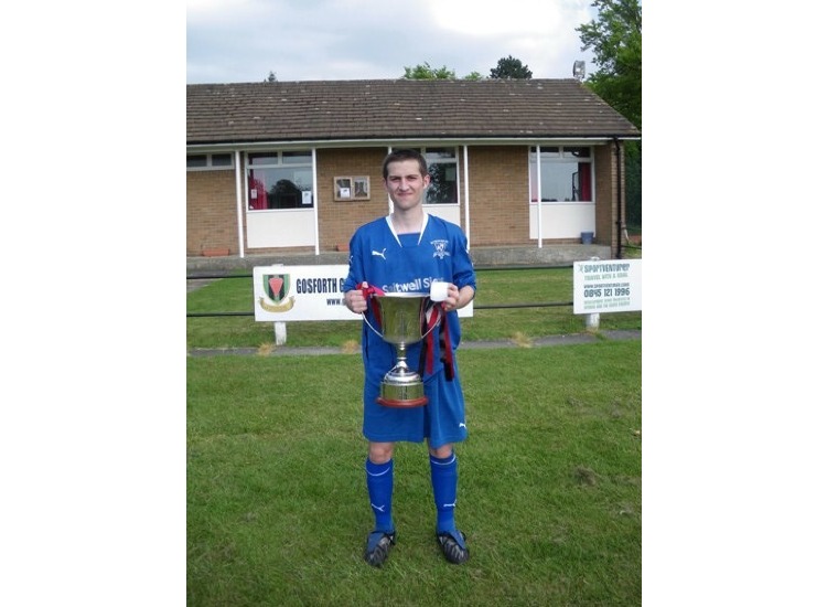 Robbie Frame with the championship trophy.