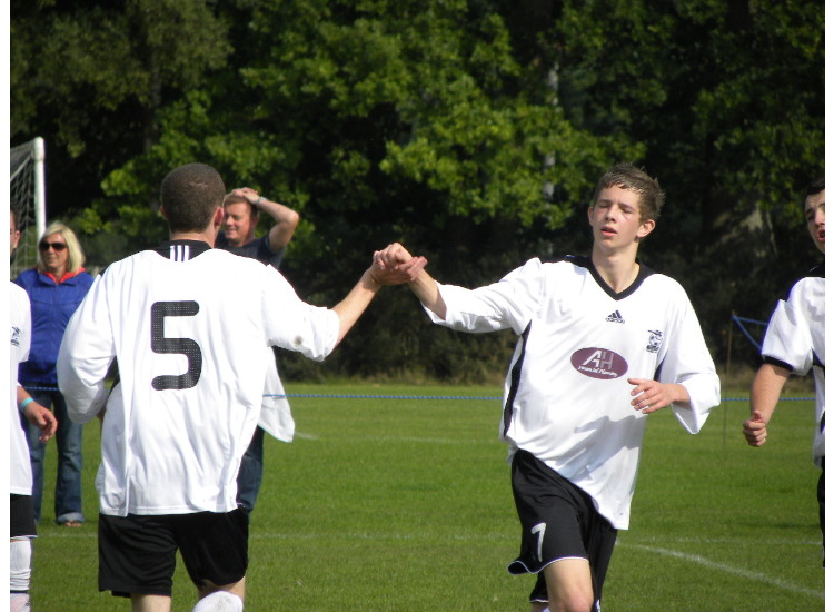  no 5 Luke Powell takes goal and praise from team mate Jamie Watkinson 