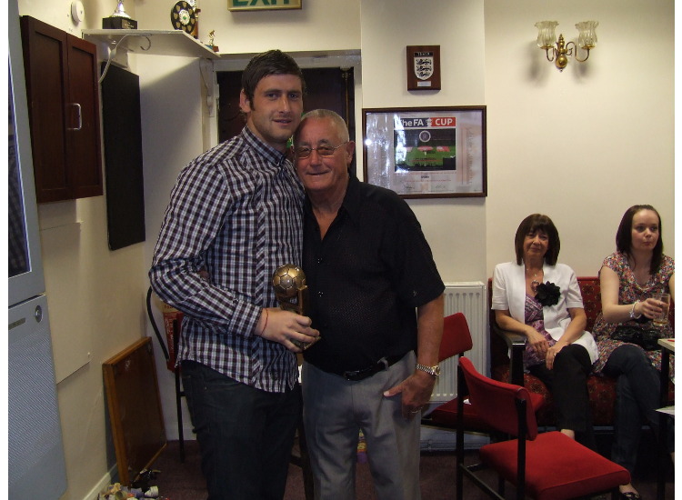 John Atkinson presents 'Bobby' Moore with the Board of Management Player of the Year trophy.