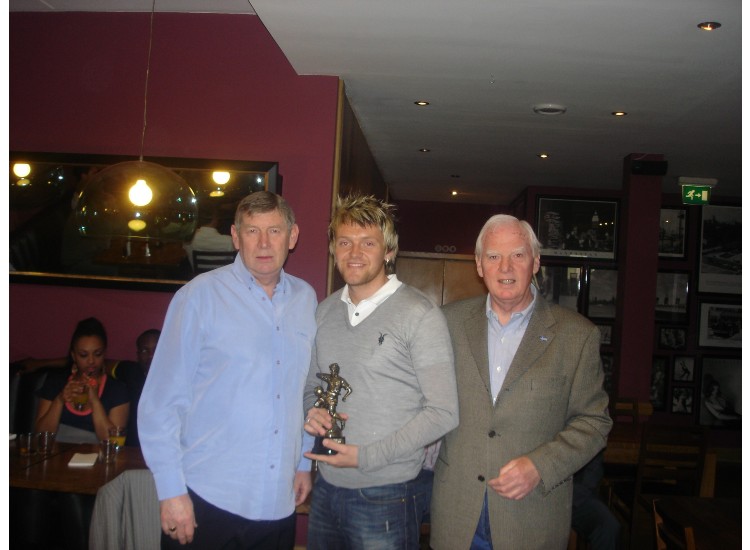 Richard Styles picks up one of his awards from Bruce and Brian