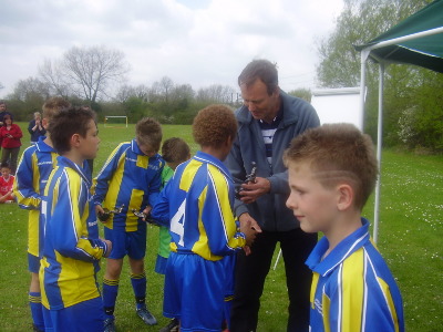 Mr Kim Hazeldine, Head of south Gloucestershire Sports Development, presenting last seasons South glos under 11's with their Cotswold and District 6 aside winners medals. 