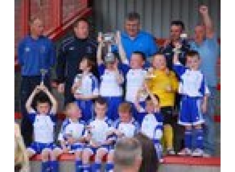 The Boy's show off thier trophies