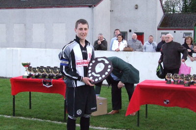 Captain Emmett Finnegan lifting the SBYL Under 17 Premier Division League trophy. Plunkett also won SBYL Cup to complete the domestic double.