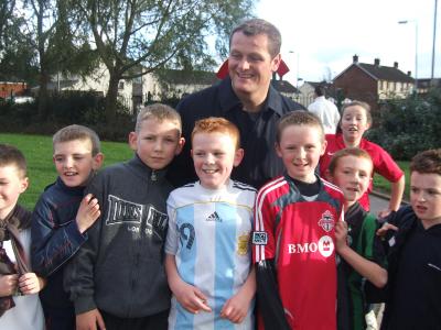 Plunkett legend Jim Magilton surrounded by mini soccer participants.