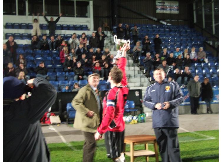 Niall holds the cup aloft