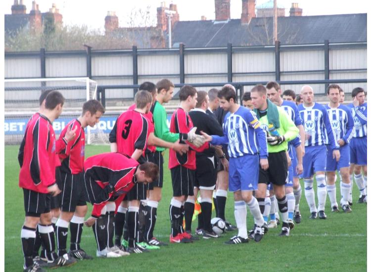 The teams shake hands