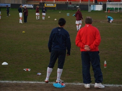 Arsenal Manager Vic Akers watches on while the Arsenal Ladies warm up before the game