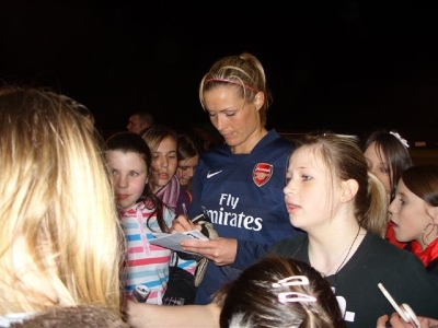 Emma Byrne the Arsenal goalkeeper signs autographs after the game
