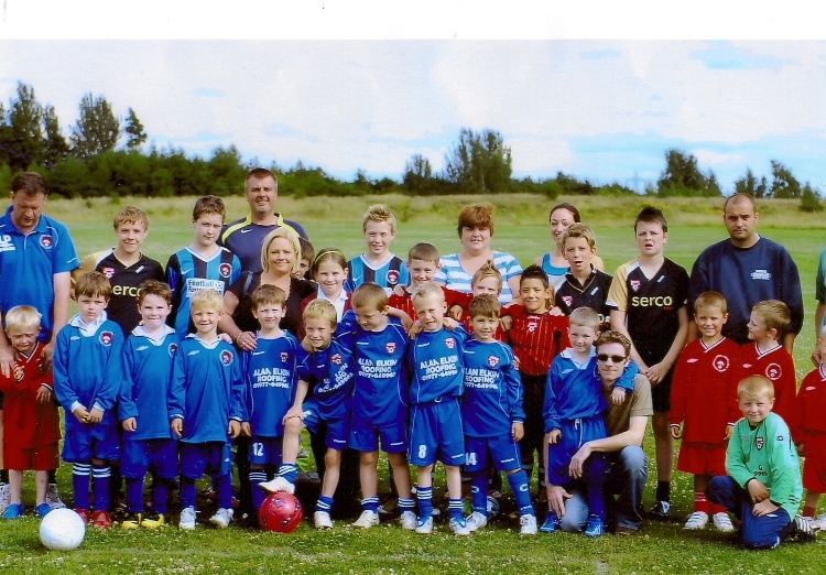 Photo taken for the article in the Local Express.  Shows a mixture of players / parents / coaches from various age groups.