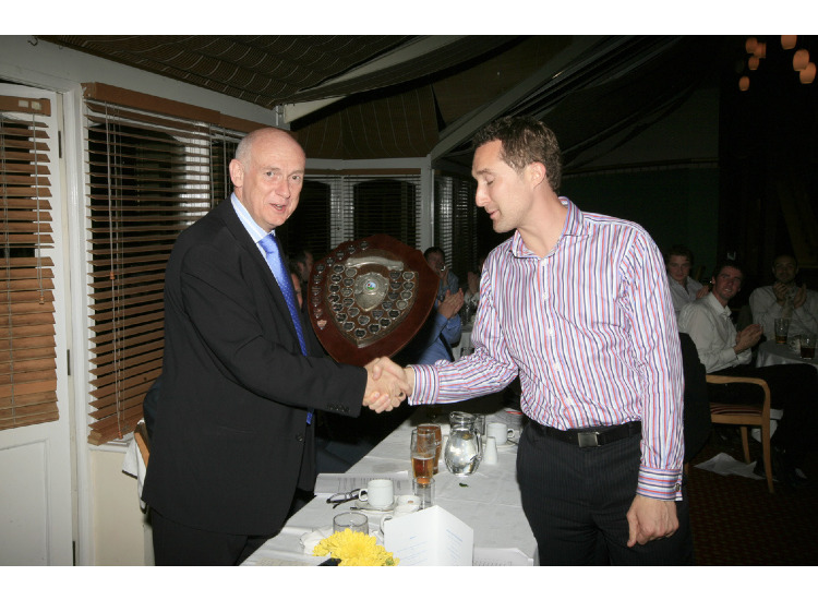 Leo Carter-Smith receives the Chris Hardy Clubman of the Year Award from Andy Proudfoot