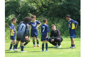 Paul gives his words of wisdom to his team which won the U10 - U12 age group 