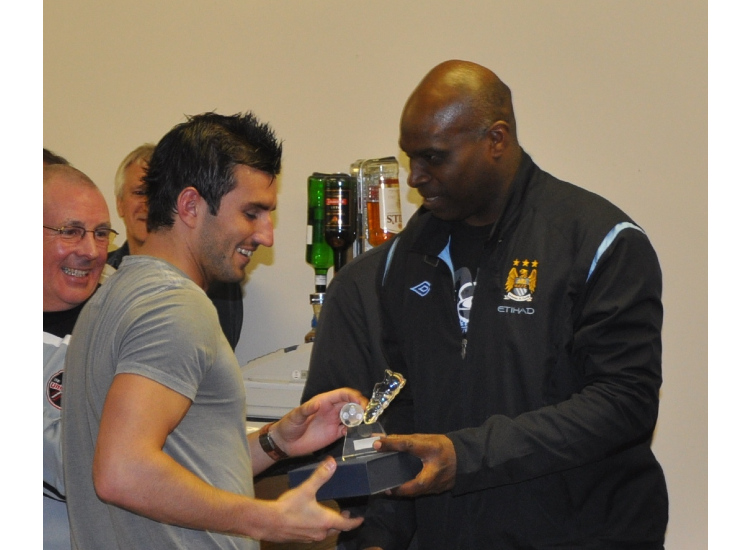 Alex Williams presents Mike Aston with the Player of the Year trophy