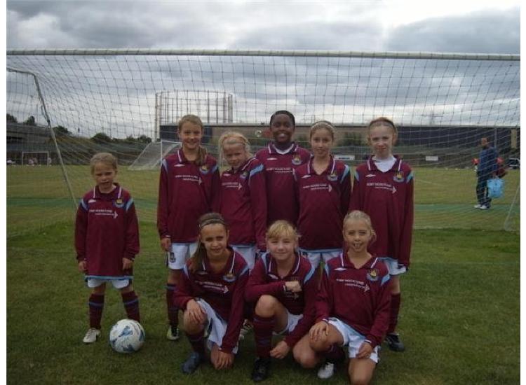 The squad line up before  the Tottenham Hotspur Festival
