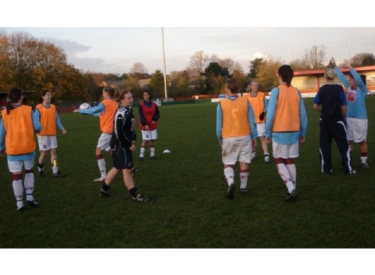 The squad warm up at Hemel Hempsted Town.