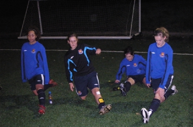 The squad stretching prior to training at Chadwell Heath