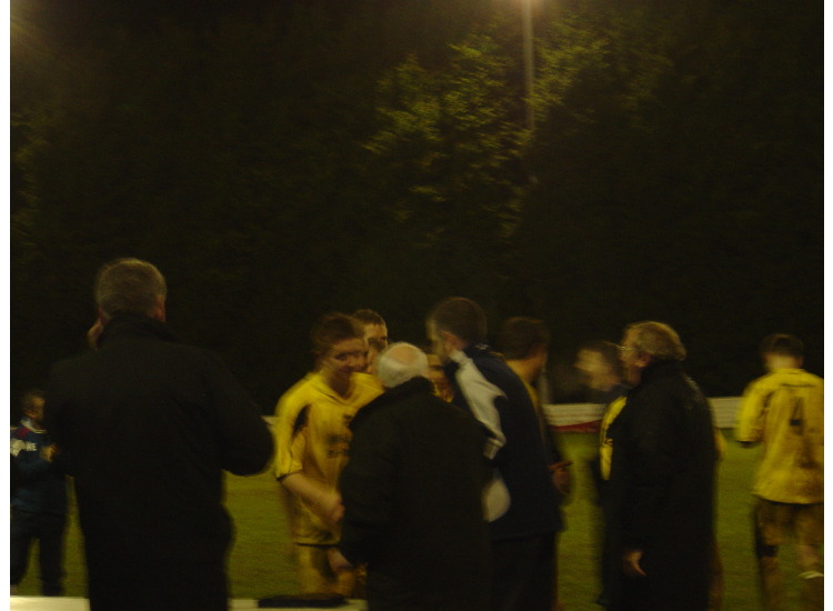 Ben wood receives cup from Ron Holpin