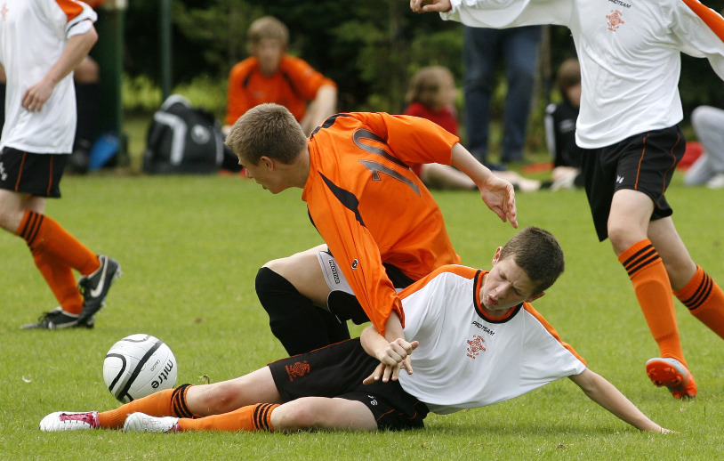 Charlie Turner battles with St Kevins players
