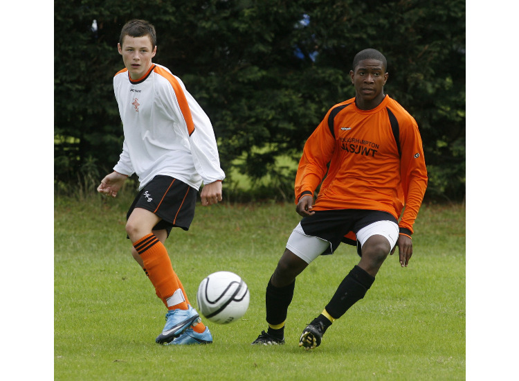 Clifton Forbes making sure this St kevins forward does not pass